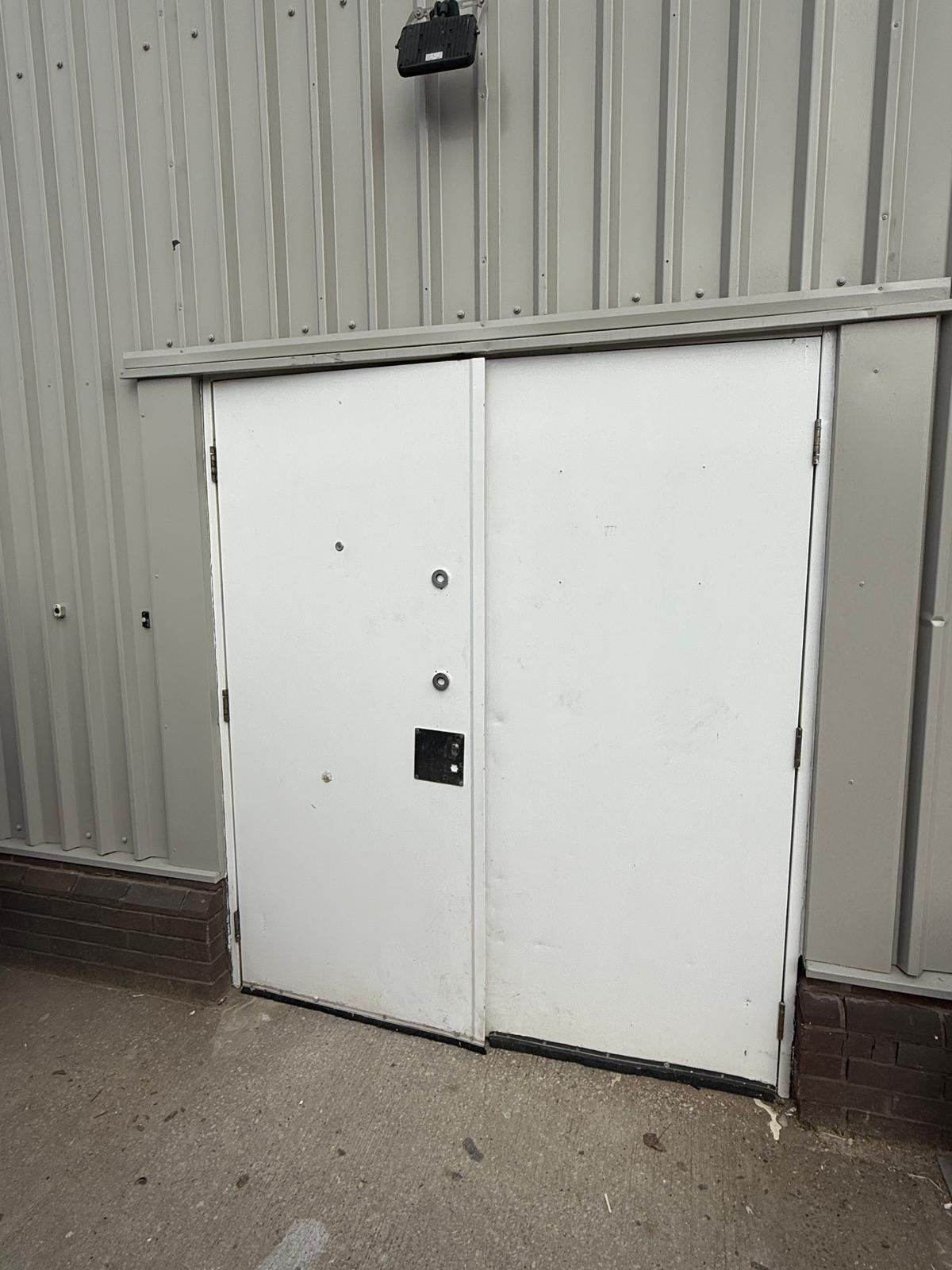 Commercial unit with a large sprayed door