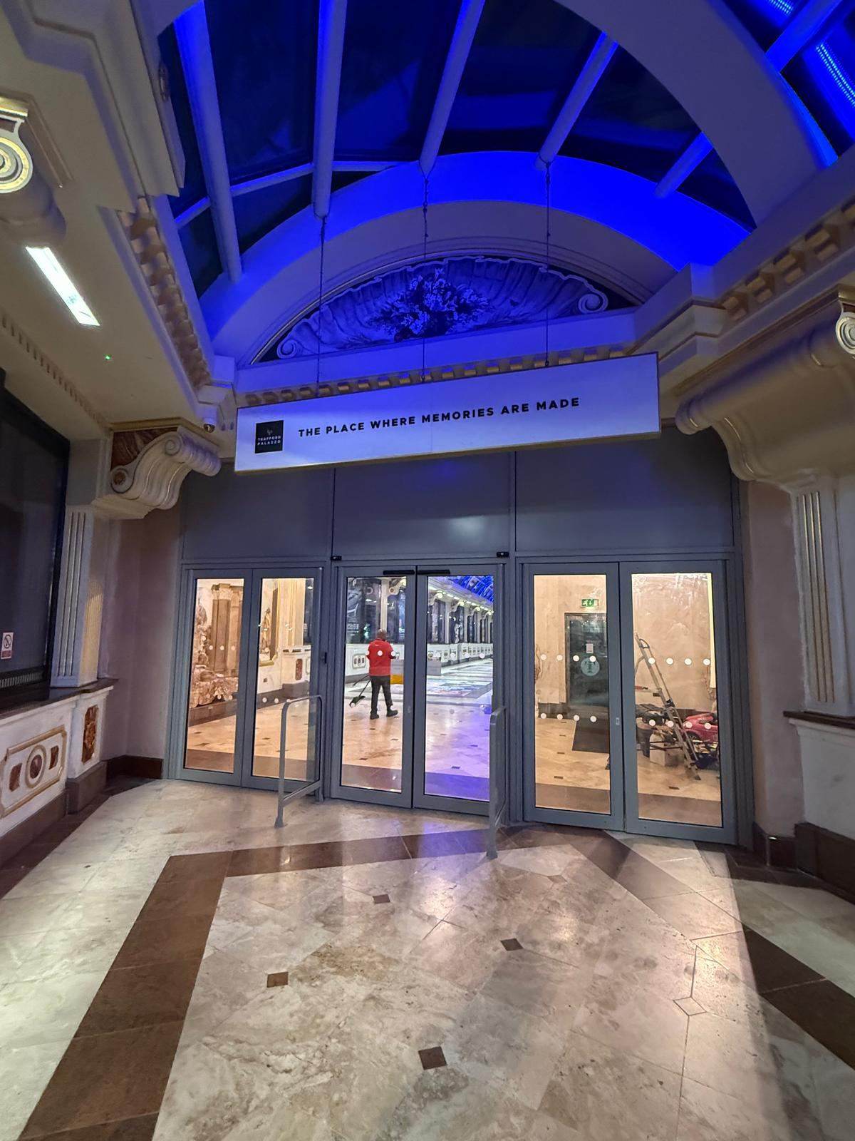 Marble foyer with glazed doors and frames sprayed