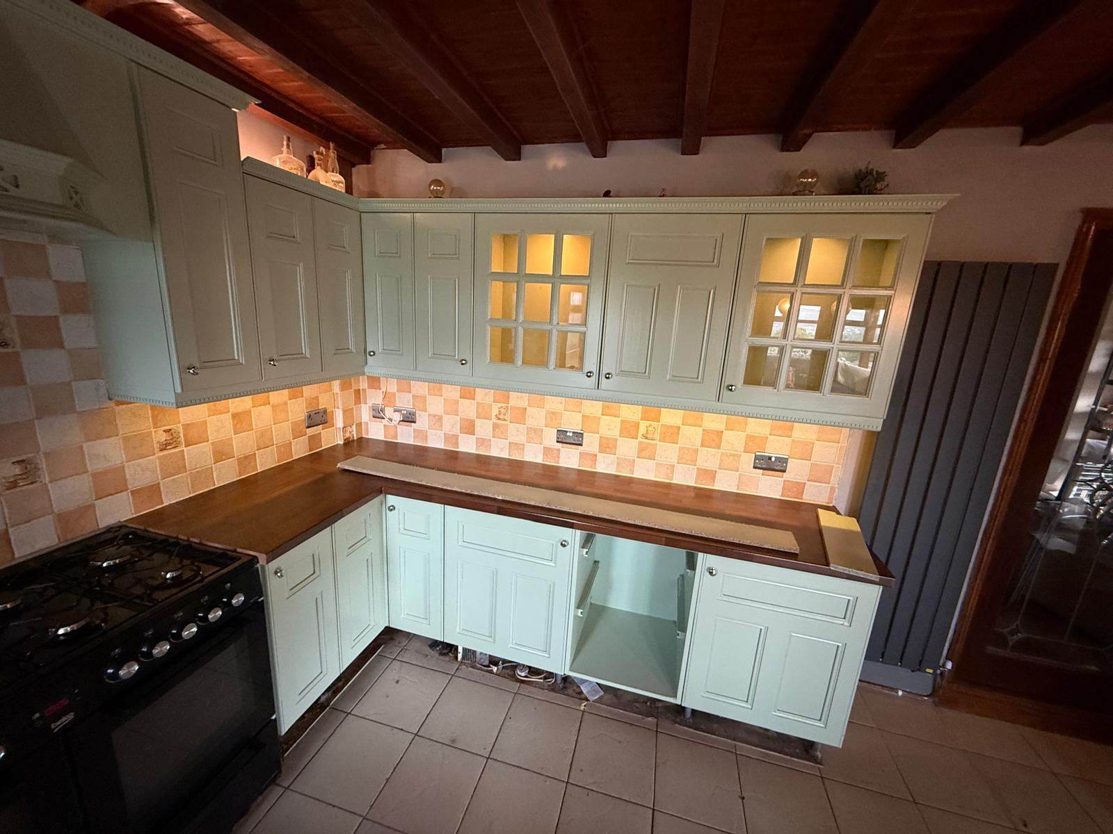 Farmhouse-style kitchen with cabinet doors resprayed