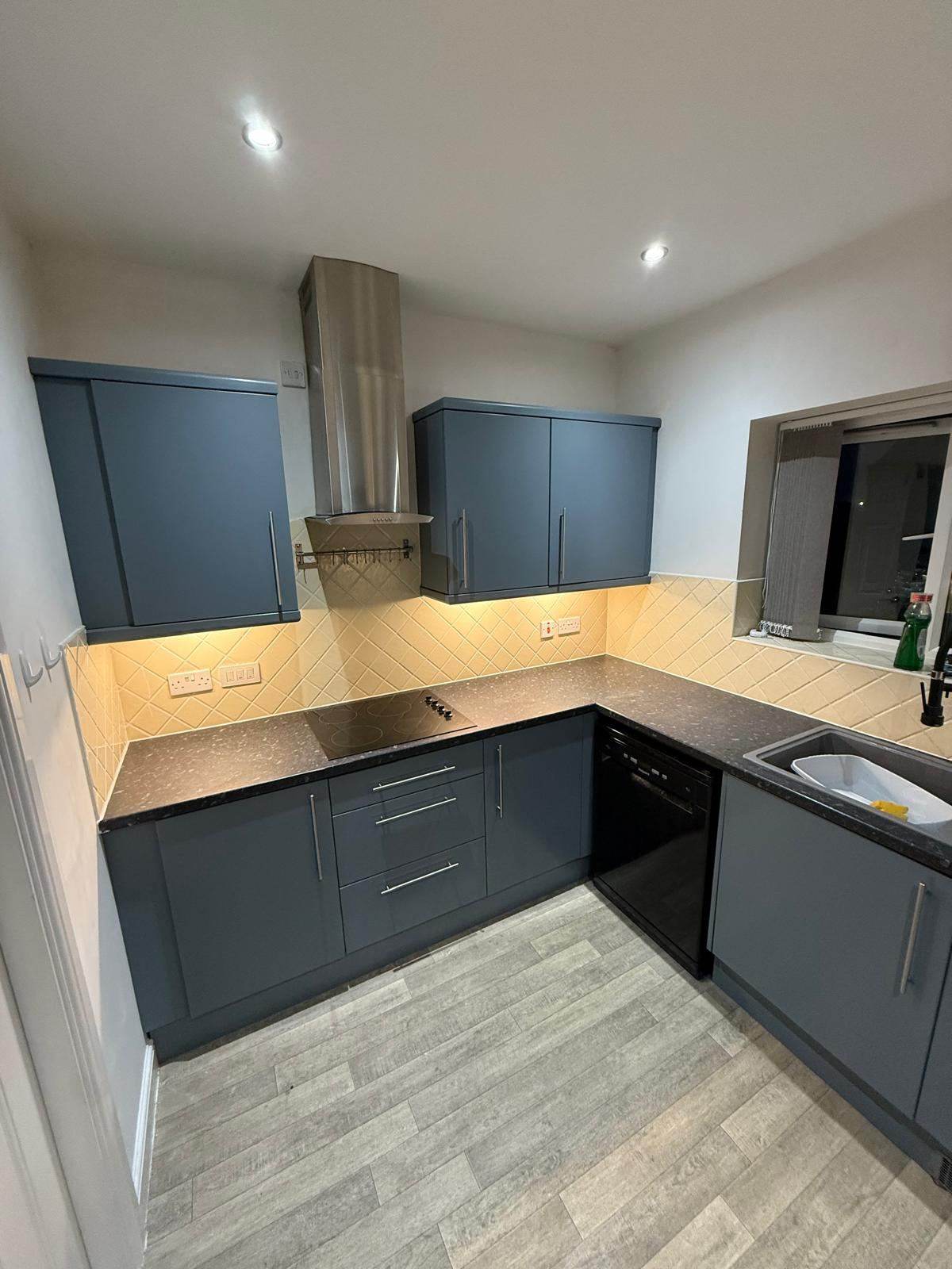 Kitchen with cabinet doors sprayed navy blue