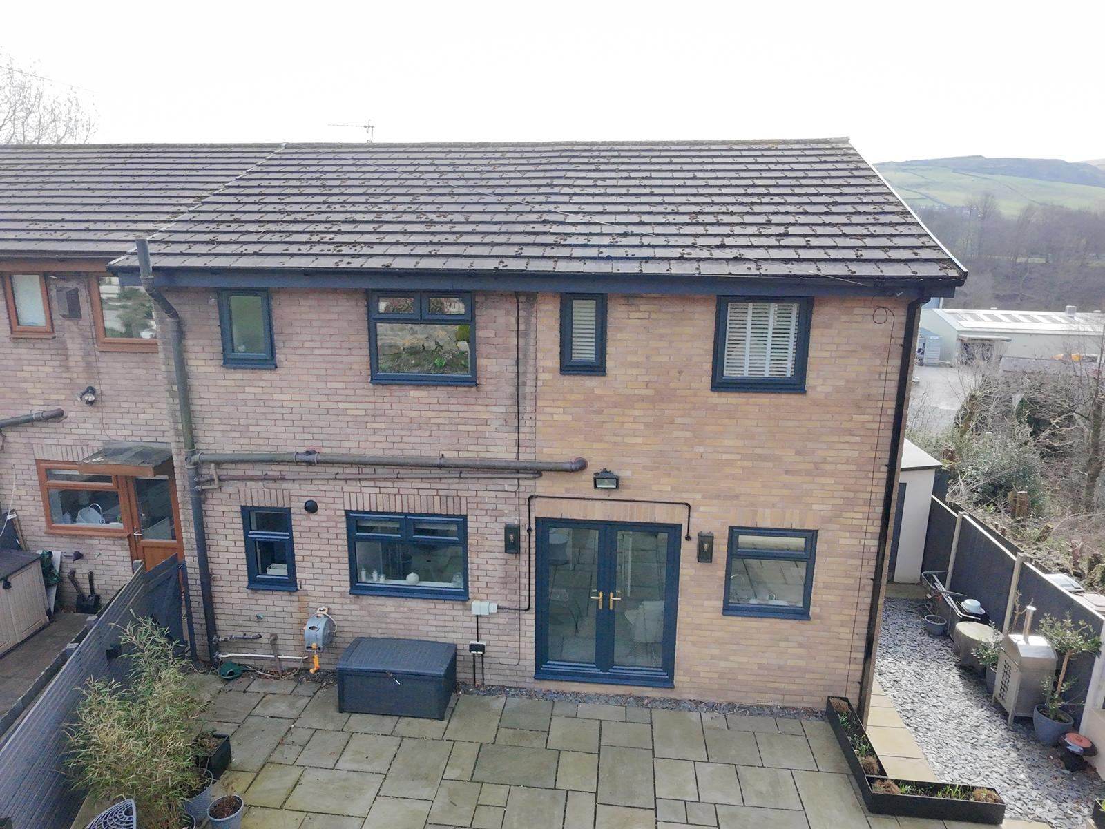 Brick terrace house with black window frames
